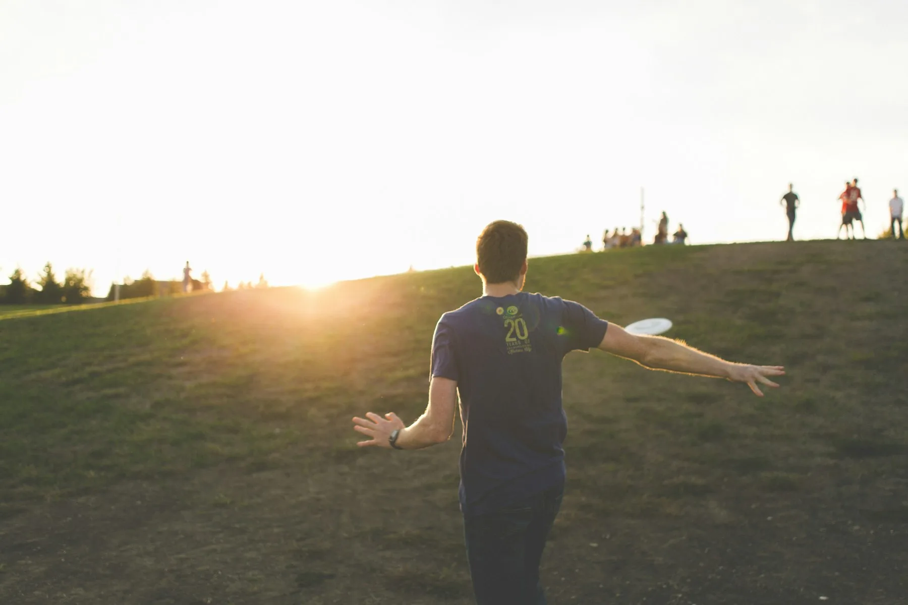 Ultimate Frisbee player throwing a flying disc